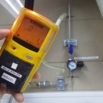 Personal H2S Gas Detector,Check gas leak. Safety concept of safety and security system on offshore oil and gas processing platform, hand hold gas detector.